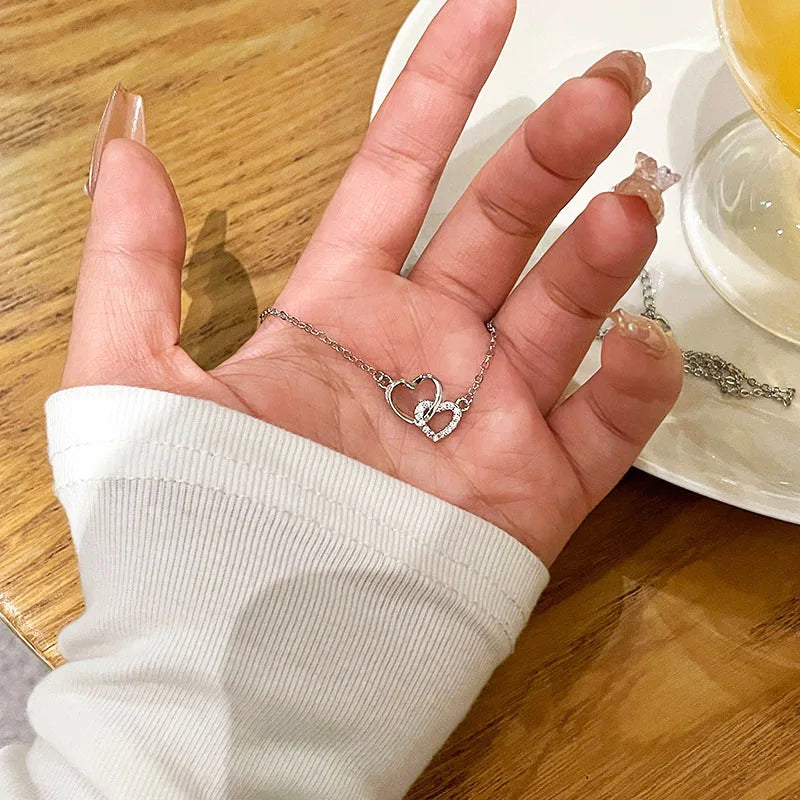 halskette zwei herzen aus silber mit zirkonia